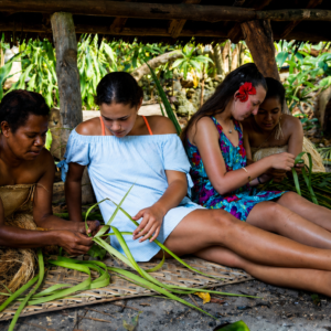 Ladies learning the traditional way of weaving