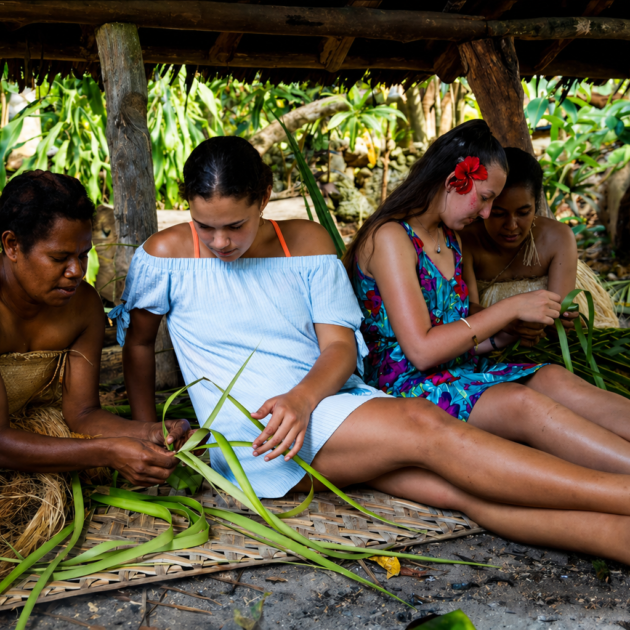 Ladies learning the traditional way of weaving