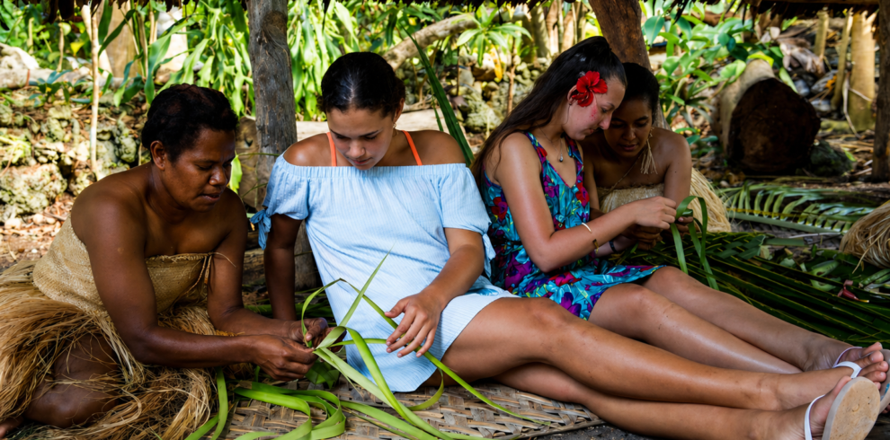 Ladies learning the traditional way of weaving
